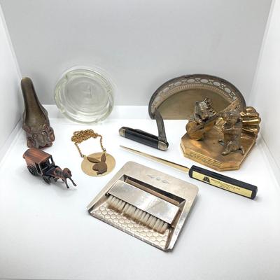 LOT 131: Vintage Collection - Dog Brass Book Ends, Pipe Holder, Playboy Ashtray and Necklace, Robeson Pocket Knife, Sheffield Crumb Tray...