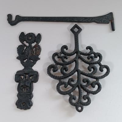 LOT 185: Cast Iron Trivets, Pewter Bean Pots, Pressed Glass Cakestand & More