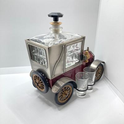 LOT 192: Vintage Automobile Decanter with Shot Glasses, Hallmark Kiddie Car Classics Toy Car, 1987 Glasstown Auto Show Paper Weight and...