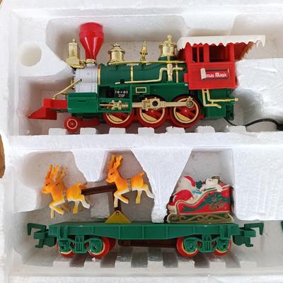 LOT 223: Vintage Christmas Train Sets with Santa in Rocking Chair & Rudolph and Santa