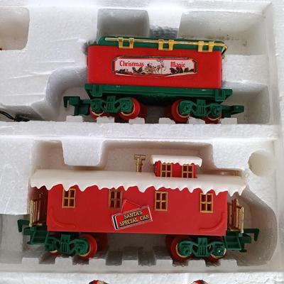 LOT 223: Vintage Christmas Train Sets with Santa in Rocking Chair & Rudolph and Santa
