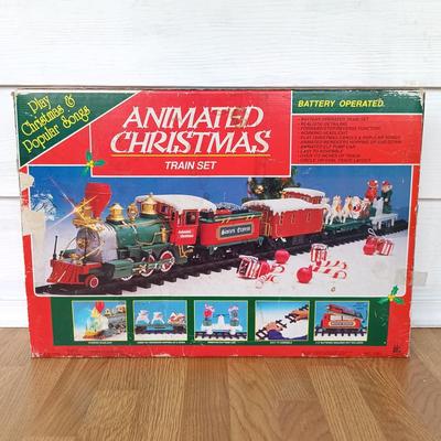 LOT 223: Vintage Christmas Train Sets with Santa in Rocking Chair & Rudolph and Santa