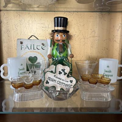 LOT 86: It's Good to Be Irish Collection: Nutcracker, Milk Glass Mugs, Clear & Amber Shamrock Trinket Dishes & More