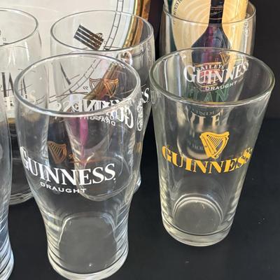 LOT 248: Guinness Collection: Wooden Clock, Pint Glasses and a Framed Poster