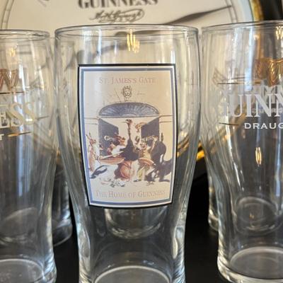 LOT 248: Guinness Collection: Wooden Clock, Pint Glasses and a Framed Poster
