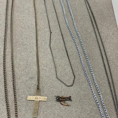 Chains with cross pendant and bird pin