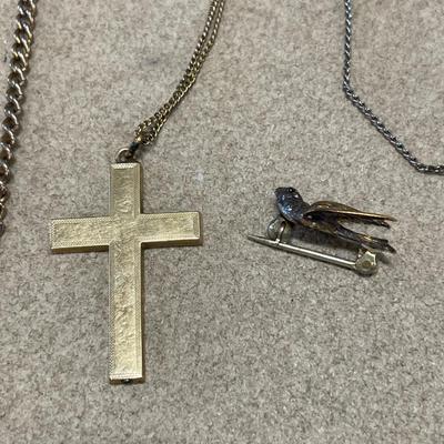 Chains with cross pendant and bird pin
