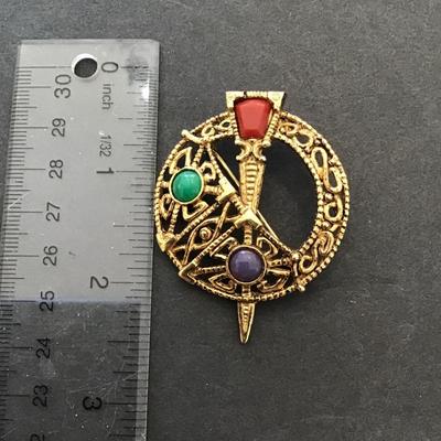 Sale Photo Thumbnail #49: Vintage gold tone , Sol d or, Celtic brooch. Please see attached photos.