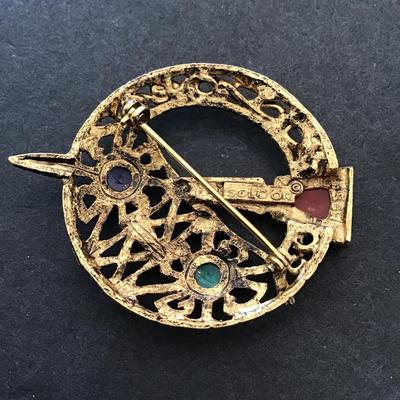 Sale Photo Thumbnail #50: Vintage gold tone , Sol d or, Celtic brooch. Please see attached photos.