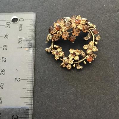Sale Photo Thumbnail #88: Beautiful vintage, goldtone brooch with rhinestones signed by Beau jewelry. Please see Taz photos.