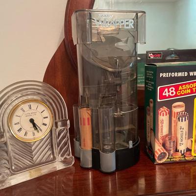 Money wrapper with tubes and crystal clock