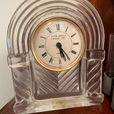 Money wrapper with tubes and crystal clock