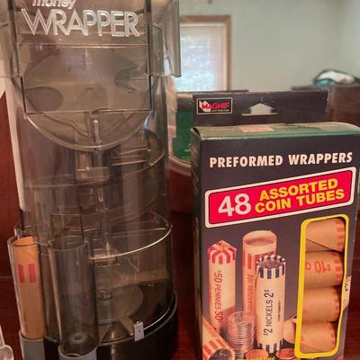 Money wrapper with tubes and crystal clock