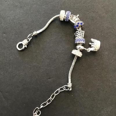 Sale Photo Thumbnail #96: Silvertone charm bracelet. Please see attached photos.