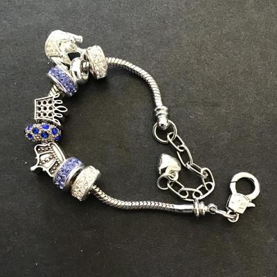 Sale Photo Thumbnail #98: Silvertone charm bracelet. Please see attached photos.