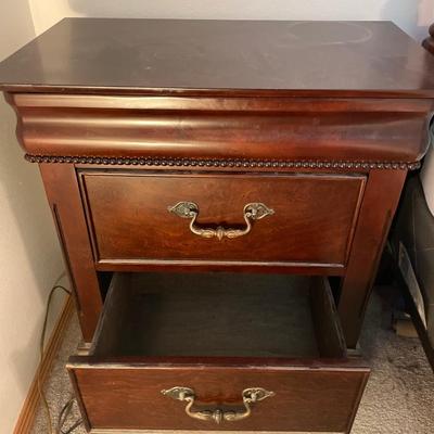 Pair of nightstands with hidden drawer