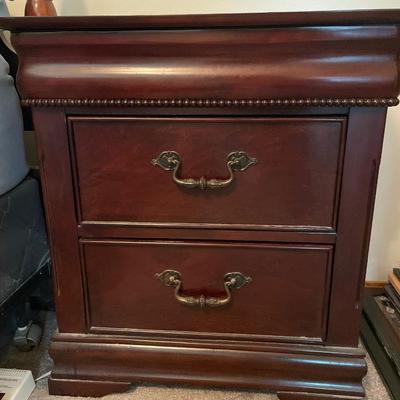 Pair of nightstands with hidden drawer