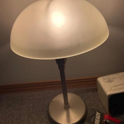 Lamp with clock and flashlights