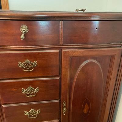 Tall boy dresser with shell design