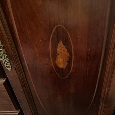 Tall boy dresser with shell design
