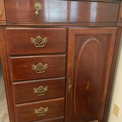 Tall boy dresser with shell design