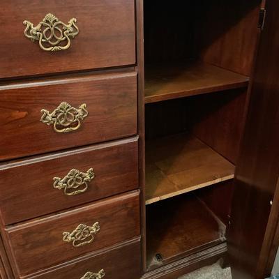 Tall boy dresser with shell design