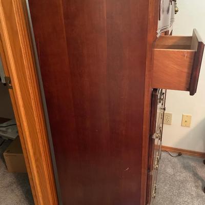 Tall boy dresser with shell design
