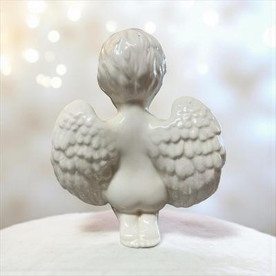 Sale Photo Thumbnail #193: Ceramic Praying Cherub and Pillow.   Approximately 7" tall