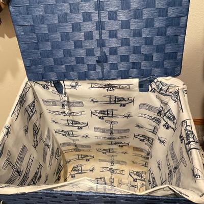 Large collection of ties with blue hamper