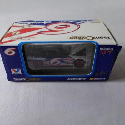 Sale Photo Thumbnail #148: 1999 Valvoline Hot Wheels Roush Racing Rock America 1:64 Scale (Writing on reverse) / 2000 Valvoline Stars & Stripes Ford Taurus 1:64 Scale #O066162SS