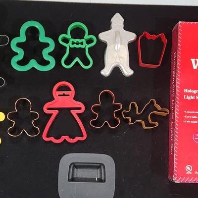 Sale Photo Thumbnail #422: Vintage Christmas Cookie Cutter Gingerbread & Boston Warehouse Spreaders. Also Santa's Work bench Icicle Decorations

Will receive all items as pictured.
