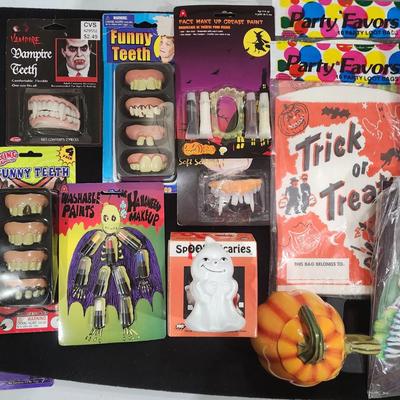 Sale Photo Thumbnail #385: Huge Vintage Halloween Costume Decorations & much more lot. Just in time for Halloween. Includes Vampire Teeth , Spooky makeup , Trick-or-treat bags Deadman Costume and much more.

Will receive all items pictured as is.