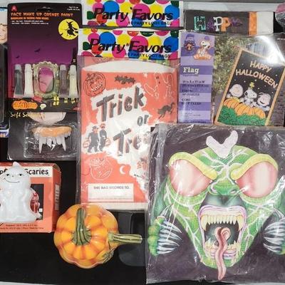 Sale Photo Thumbnail #384: Huge Vintage Halloween Costume Decorations & much more lot. Just in time for Halloween. Includes Vampire Teeth , Spooky makeup , Trick-or-treat bags Deadman Costume and much more.

Will receive all items pictured as is.