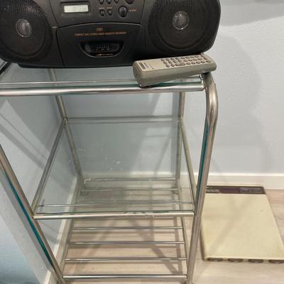 Radio on silver and glass storage with Sharp scale