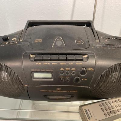 Radio on silver and glass storage with Sharp scale