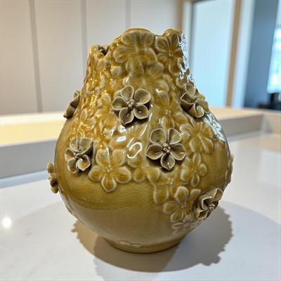 Sale Photo Thumbnail #334: Benjara Remi Yellow Ceramic Round Decorative Flower Vase  Has one broke flower on the vase.  Unbranded
Approximately 8.5" tall