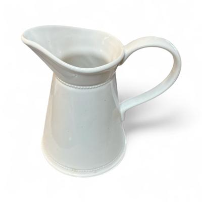Sale Photo Thumbnail #336: White Glazed Pitcher With Large Hand and beaded bands around the neck and base   By Martha Stewart
Approximately 8" Tall