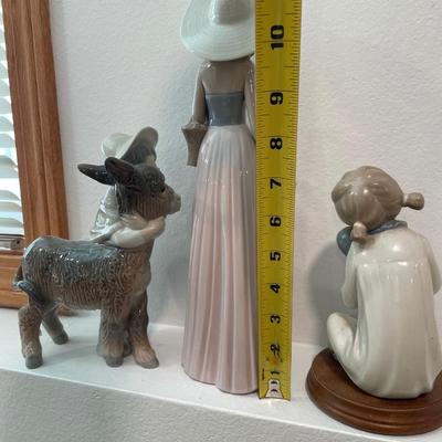 Lladro donkey, Nau tall lady and girl figures