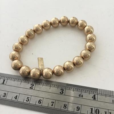 Marked gold tone beaded stretchy bracelet