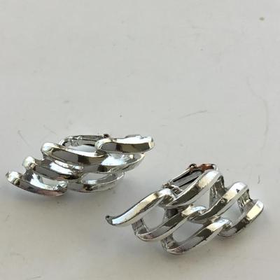 Silver tone vintage clip on swirl earrings