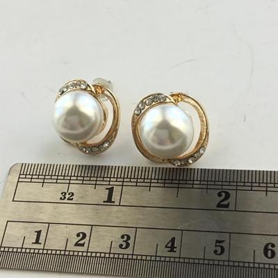 Gold tone faux pearl stud earrings