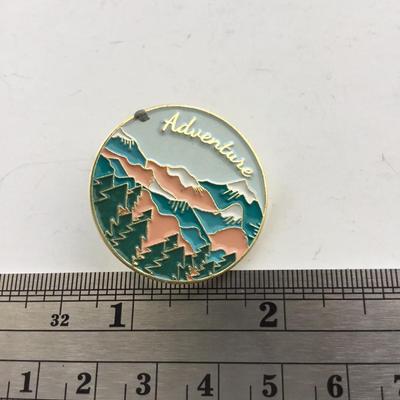 Gold tone adventure push pin