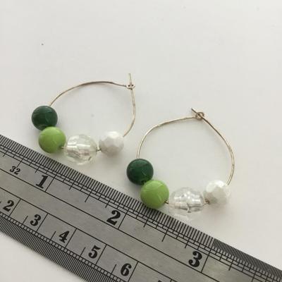 Silver tone light green hoop earrings
