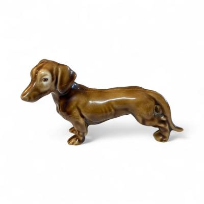 Sale Photo Thumbnail #373: Set Of 4 Dachshund Figurines   Three Ceramic and one Brass
Approximately  4" Long