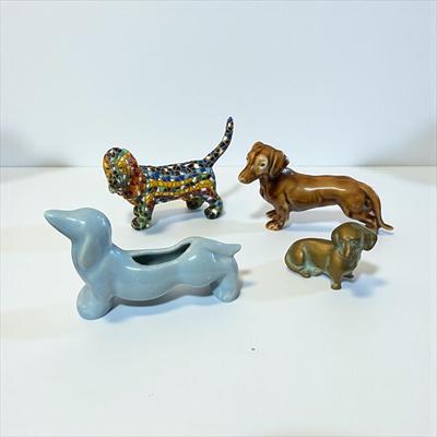 Sale Photo Thumbnail #375: Set Of 4 Dachshund Figurines   Three Ceramic and one Brass
Approximately  4" Long