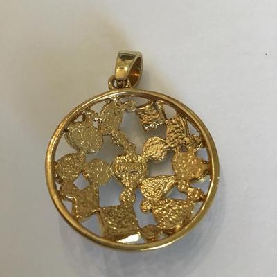 Vintage Roman signed gold tone pendant with green Rhinestones