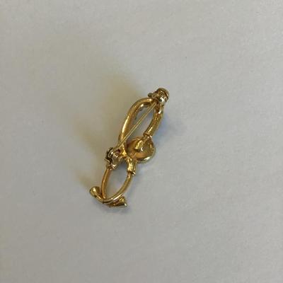 Gold tone brooch with Rhinestones