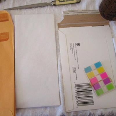Sale Photo Thumbnail #111: Desk drawer organizer,  paper clips (various sizes), post-it notes, post-it flags, small metal ruler, circle template, 2 staple removers, note pads, #10 envelopes, correction tape, letter opener with knife, hole punch, Command hooks, etc.