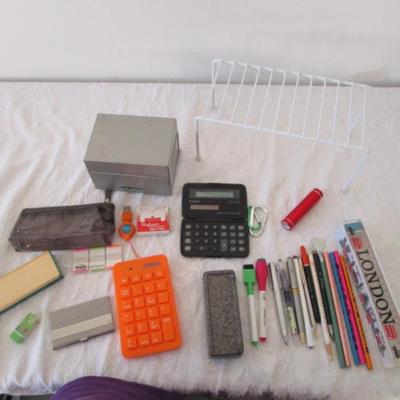 Sale Photo Thumbnail #124: Solar calculator, 2 pencil cases, 3x5 index card metal box, small metal shelf, drawing pencils, USB keypad, Expo markers & eraser, file tabs, business card holder, USB power bank, etc.