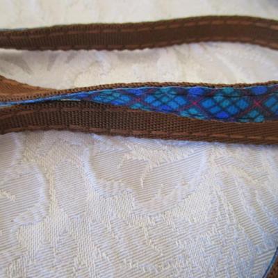 Sale Photo Thumbnail #150: 2 dog leashes, one new medium dog coat, 1 medium harness collar, Doggie cookie cutter with recipe cards. One leash is 5' x 3/4", one is 46" x 3/8"